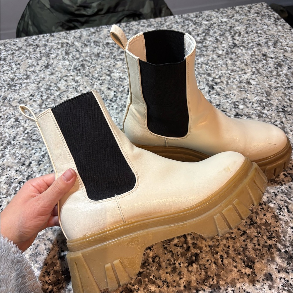 Chinese Laundry White boots with rubber sole and tred at the bottom.Lightly used